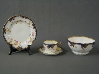 A 32 piece Coalport style tea service with 2 circular bread plates, 12 7" tea plates, 11 saucers (1 cracked), 7 tea cups (1 cracked), slop pail, base marked RD250594