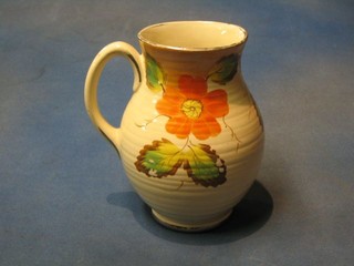 A 1930's Art Deco Arthur Wood pottery jug with orange flower head decoration and spider's web 8"