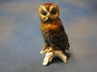 A Continental porcelain figure of a seated owl, base incised 75 75 10"