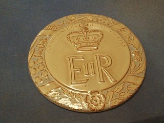 A circular Marsden tile to commemorate the 1953 Coronation of HM The Queen, chip to base