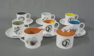 A Susie Cooper 14 piece coffee service comprising cream jug, sucrier, 6 cups and 6 saucers with colourful interiors each cup and saucer decorated a matching piece of monochrome fruit