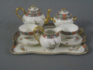 A 6 piece Limoges porcelain cabaret set with tray, teapot, twin handled sucrier, 2 cups and 2 saucers, cream jug (f)
