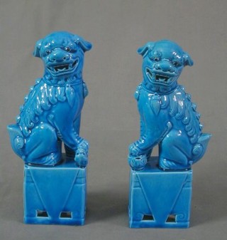 A pair of turquoise glazed porcelain dogs of fo 9", a pair of cut glass vases with silver mounts 6" and a green glazed pottery figure of a startled cat 6"