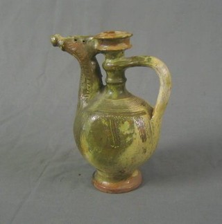 A Persian terracotta green glazed wine flagon 10"