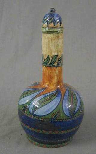 A Persian pottery baluster shaped wine jar and cover (lid f and r) 13"