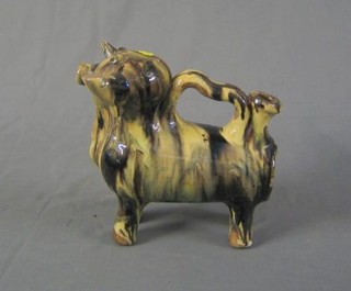 A French terracotta black and white glazed wine ewer in the form of a bull 8" (horn chipped)