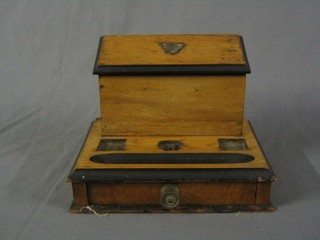 A 19th Century honey oak stationery box incorporating an ink stand with inkwell holder, the base fitted a drawer and a  mahogany music stand 11"
