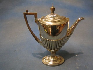 An oval silver plated coffee pot with demi-reeded decoration