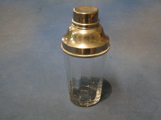 A glass and silver plated cocktail shaker