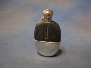 A 19th/20th Century oval glass hip flask with detachable silver plated cup