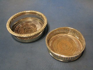 2 circular pierced silver plated bottle coasters and 1 other with porcelain base