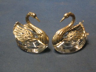A pair of German cut glass salts in the form of swans with pierced silver wings