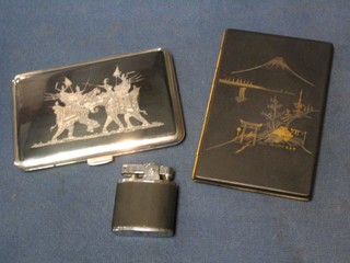 A Singapore engraved silver cigarette case with niello decoration and an Eastern cigarette case and a ditto lighter