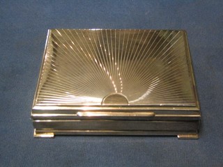 A 1960's engraved Continental silver cigarette box with hinged lid, raised on bracket feet 5"
