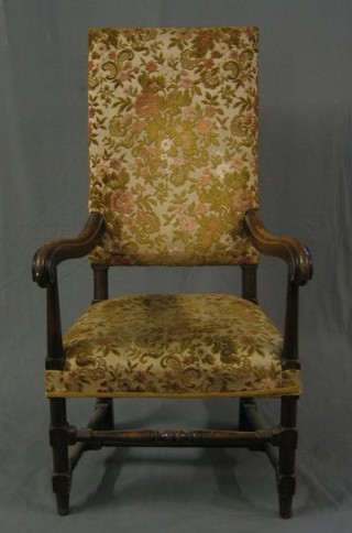 An oak framed Carolean style high back open arm chair on turned and block supports