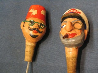 2 bottle pourers, 1 in the form of a ships captain with monocle and cigar the other an Egyptian gentleman