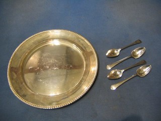 A circular silver plated dish with gadrooned border and 4 Old English pattern silver plated grapefruit spoons