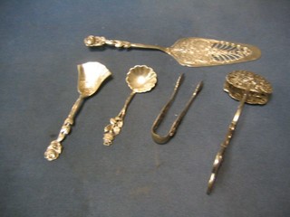 A pierced Continental silver cake server, a pair of pierced Continental silver sandwich servers, do. sugar tongs and 2 do. preserve spoons