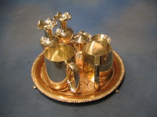 A circular engraved silver plated salver 12", 2 silver plated tankards, 2 Eastern silver plated vases and  2 vases of campanular form