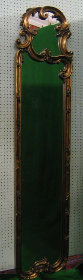 A French style rectangular salon mirror contained in a gilt frame 64"