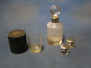 A circular cut glass scent bottle with silver rim, 2 circular cut glass rouge pots and a medicine measure