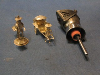A silver plated spirit pourer in the form of a knight, an Eastern silver model of a rickshaw 2" and an Eastern silver model of a gentleman with yoke