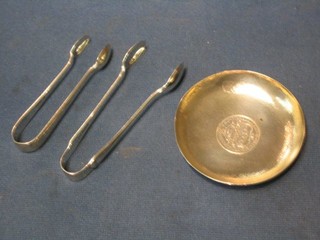 A Continental circular silver ashtray set a George V florin 3" and 2 pairs of silver sugar tongs