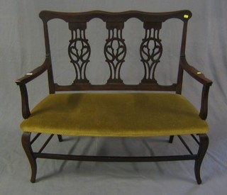 An Edwardian mahogany 3 piece drawing room suite comprising double chair back settee and 2 open arm carver chairs with pierced slat backs