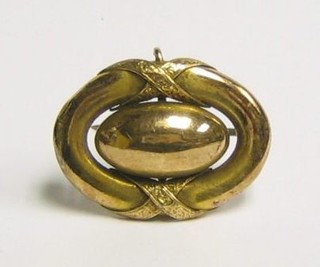 An Edwardian "gold" oval brooch