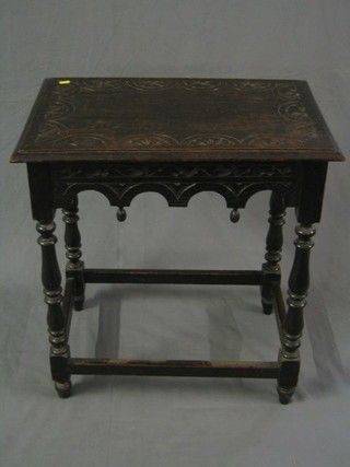 A Victorian rectangular carved oak occasional table raised on turned and block supports 26"