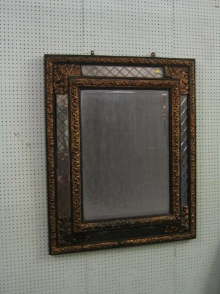 A 19th/20th Century French cut glass bevelled plate mirror with embossed gilt metal mounts 40"