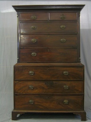 A Georgian mahogany chest on chest with moulded and dentil cornice, the upper section with canted corners and fitted 2 short and 3 long drawers, the base fitted 3 long drawers, raised on bracket feet 45"