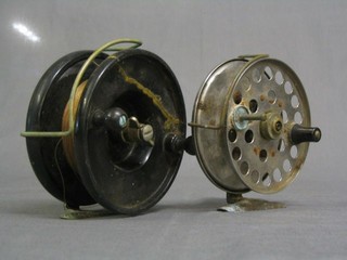 A Sea Mk.3 chromium plated fishing reel 5" and a black Bakelite fishing reel 5" (f)