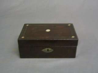 A rectangular rosewood trinket box with hinged lid and and inlaid mother of pearl decoration 8"