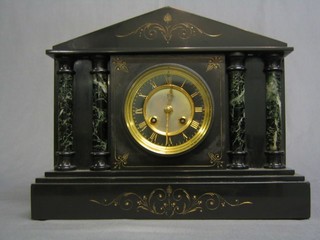 A Victorian French 8 day  striking mantel clock contained in a 2 colour black and green marble architectural case
