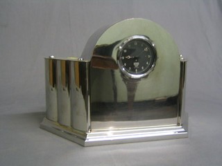A 1930's Smiths 8 day car clock contained in an arched chromium plated case 