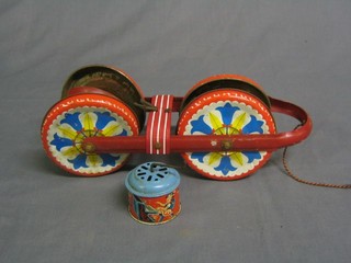 A childs English tin plate toy and 1 other