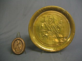 An embossed copper Johnnie Walker advertising ashtray 5" and an embossed brass Butler's advertising tray 13"