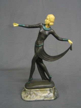 An Art Deco style figure of a walking lady