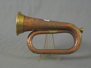 A brass and copper bugle by Hawkes & Sons, Denmar St. Picadilly Circus London W1, dated 1919