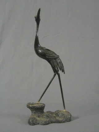 A bronze figure of a standing crane 18" (f and r)