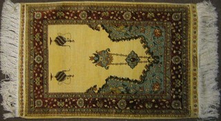 A fine quality 19th Century silk Turkish Hereke prayer rug with Mihrab and mosque lantern to the centre 32" x 21"