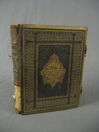 A leather and metal bound Holy bible (requires attention)