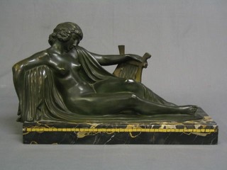 An Art Deco bronze figure of a naked reclining lady with lyre, raised on a rectangular veined marble base 18"