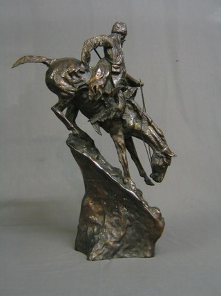 In the style of Remington a bronze figure of a mounted native Red Indian 28"