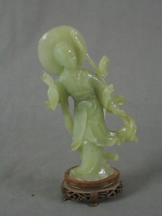An Oriental green hardstone figure of a standing sage 8"
