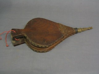 An old pair of elm and leather bellows