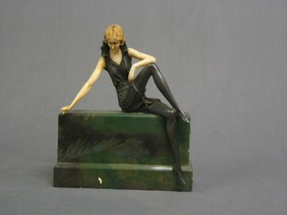 An Art Deco style figure of a seated lady 8"