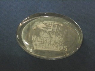 A Wilder's Fireworks oval advertising glass paperweight 4"