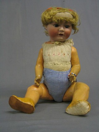 A 19th Century German doll with dimples, open and shutting eyes and open mouth, the head incised Made in Germany 3